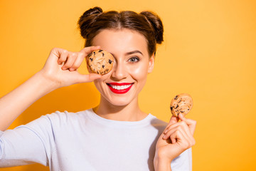 Close up photo of charming lovely hipster playing with cakes pies candies in kitchen preparing for...
