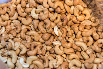 Roasted cashew nuts, texture and background. Top view.