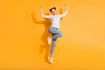 Full length body size view photo of pretty isolated charming youngster hipster screaming yeah celebrating victory in white pullover denim pink sneakers over colorful background
