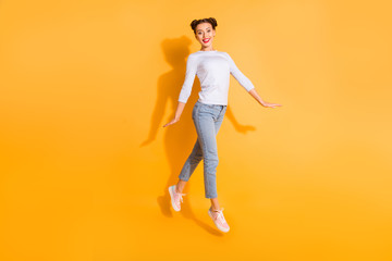 Fototapeta na wymiar Full length body size photo of adorable funny student walking promenade satisfied wearing white cotton pullover denim clothes pink sneakers on colorful background