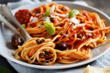 Spaghetti with tomato sauce olives and capers