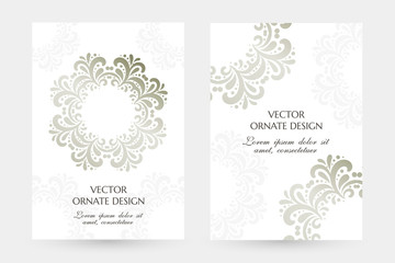 Silver floral motif. Stylish vertical posters with ornaments on the white background.