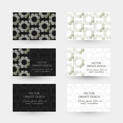 Silver floral motif. Business cards with ornaments on the black and white background.
