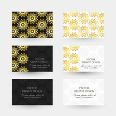 Golden floral motif. Business cards with ornaments on the black and white background.