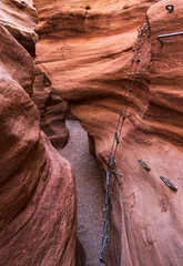 a steel cable ladder with handholds descends a section of the red canyon in the eilat mountains in israel