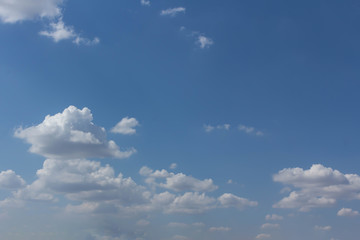 The blue sky and white clouds indicate pure and freshing