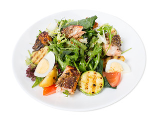 Grilled salmon salad with vegetables and eggs.