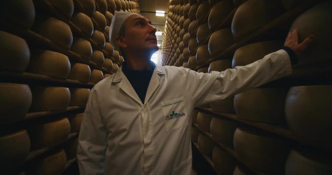 Slow motion of futuristic doctor is examining his patient's skeleton with newest technology scanning with augmented reality holograms in modern laboratory.