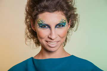 Bold image of a modern woman predator. Bright makeup women vamp.
