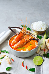 Prawn and lemon grass soup with mushrooms or Tom Yum Kung and Thai ingredient that Thai food cuisine is most popular in Thailand, vertical view.