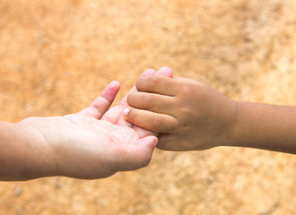 mother holding child hand