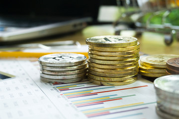 bitcoin are stacked on a background of business graphs