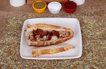 quarter of kokorec master on white plate