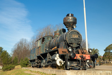 Kouvola, Finland - April 18, 2019: Old steam locomotive as an exhibit at the Kouvola railway station in Finland.