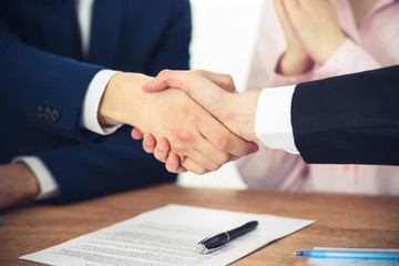 Business people shaking hands finishing up a meeting. Handshake at successful negotiation