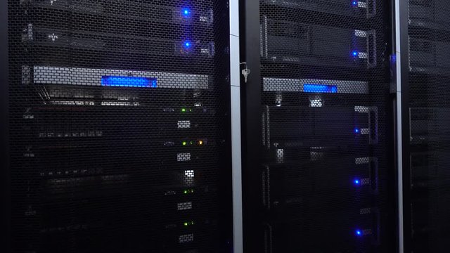 Servers in data center. Servers racks close up in Modern data center. Cloud computing datacenter server room. Motion camera.
