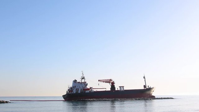 a merchant stuck on a sandy beach on a sunny day