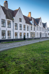 Fototapeta na wymiar House in the Begijnhof neighborhood in the Minnewater park in the city of Brugge