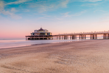 Beligum pier located in the city of Blankenberge during the morning  - obrazy, fototapety, plakaty