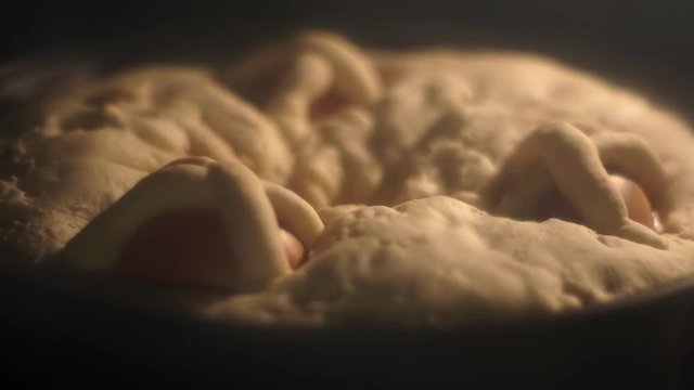 Casatiello Easter traditional Neapolitan Italian salty bread in the oven