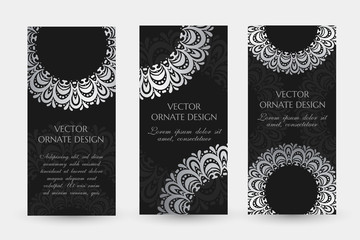 Silver circle decor. Luxury vertical flayers with ornaments on the black background.