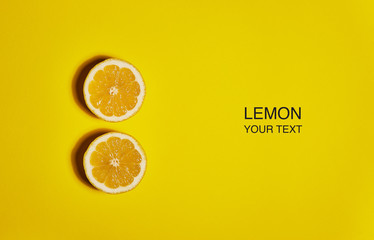 Creative layout made of lemon on yellow background. Flat lay, top view, copy space . Food concept.