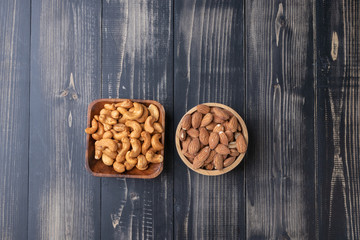 almond and Cashew nut on wooden bowl