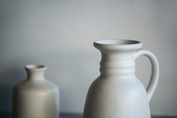 two white cans, pottery, against white background