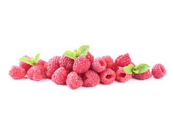 Ripe raspberries with green leafs isolated on white background