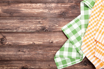 Colorful napkins on brown wooden table