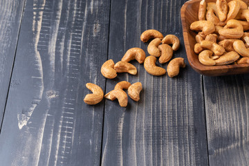 close up of Cashew nut on wooden bowl