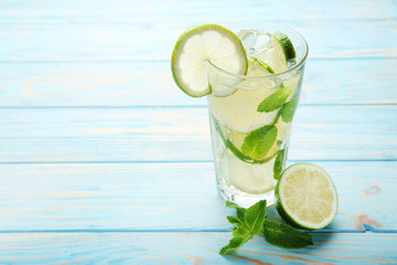 Mojito cocktail in glass on wooden table