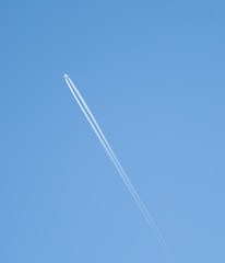 Airplane in the blue sky