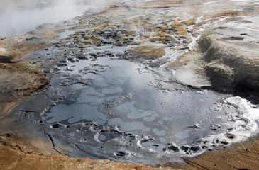 Iceland geothermal zone Namafjall - area in field of Hverir. Landscape which pools of boiling mud and hot springs. Tourist and natural attractions.