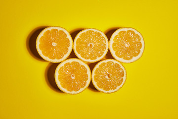 Lemon on yellow background. Flat lay, top view, copy space . Food concept.