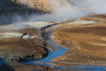 Iceland geothermal zone Namafjall - area in field of Hverir. Landscape which pools of boiling mud and hot springs. Tourist and natural attractions.
