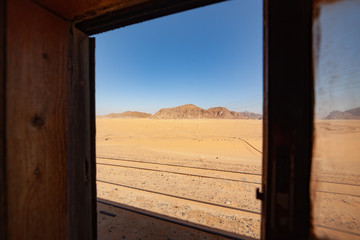 Travel of life. The journey of a lifetime. Most picturesque train road. Traveling by train by desert. Amazing train travel. View behind the window