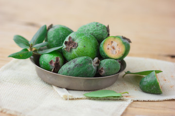 Green feijoa fruits isolated on white background. Fruits of feijoa on a white background. Tropical fruit feijoa isolated on white background. Set of ripe feijoa fruits.
