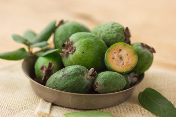 Green feijoa fruits isolated on white background. Fruits of feijoa on a white background. Tropical fruit feijoa isolated on white background. Set of ripe feijoa fruits.