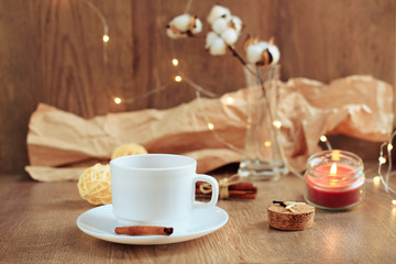 cup of coffee on a wooden background, set in warm brown tones