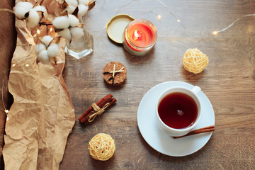cup of coffee on a wooden background, set in warm brown tones