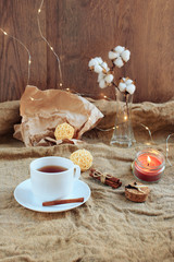 cup of coffee on a wooden background, set in warm brown tones