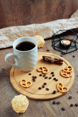 cup of coffee on a wooden background, set in warm brown tones