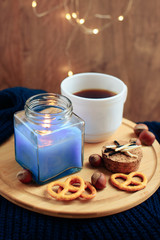 cup of coffee on a wooden background, set in warm brown tones