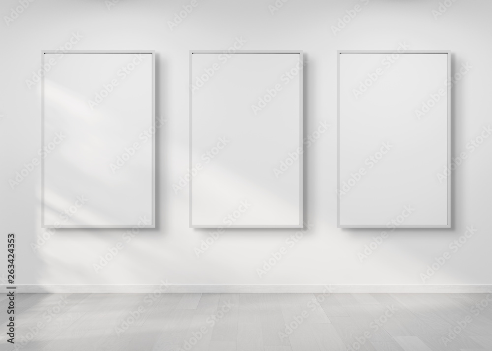 Poster Three frames hanging on a wall mockup 3d rendering