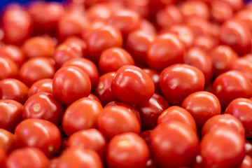 Delicious frash red tomatoes with blurred background