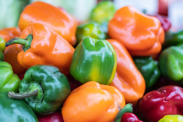 Fresh multicolored sweet peppers sold on the market