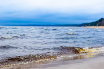 The coast of the Baltic Sea against the backdrop of a thunderstorm sky .
