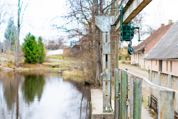 Old electroplate damper on the dam, bridge near the reservoir