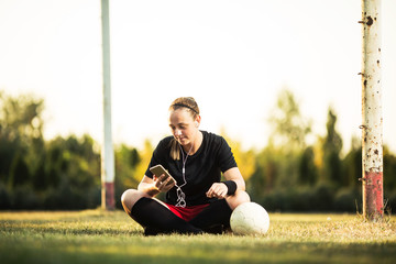 Happy female soccer player resting © bokan